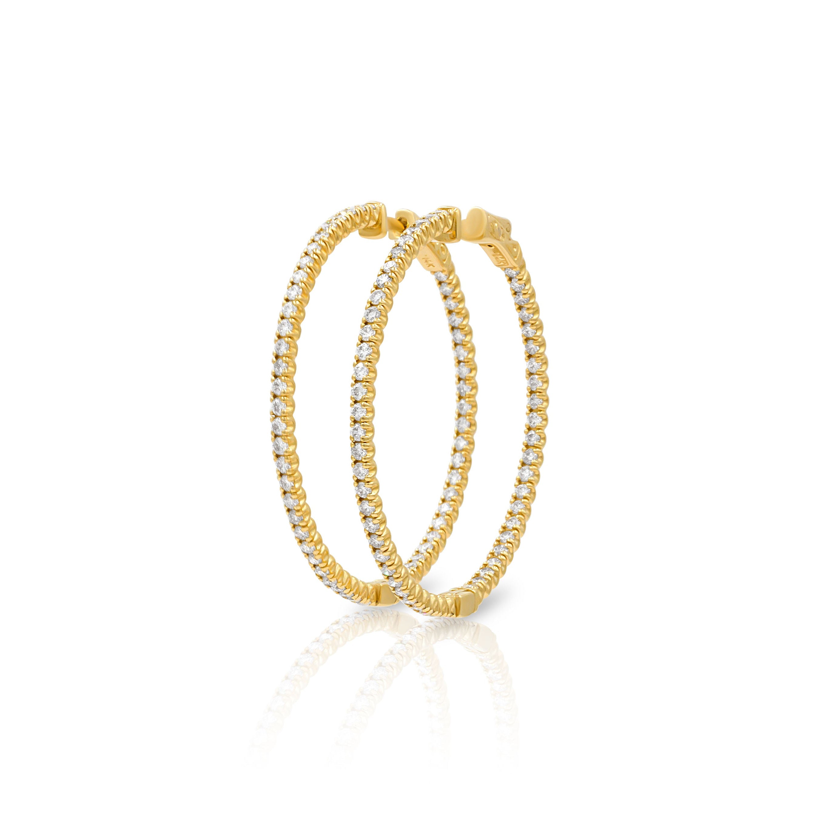 Gold hoop earrings with embedded diamonds