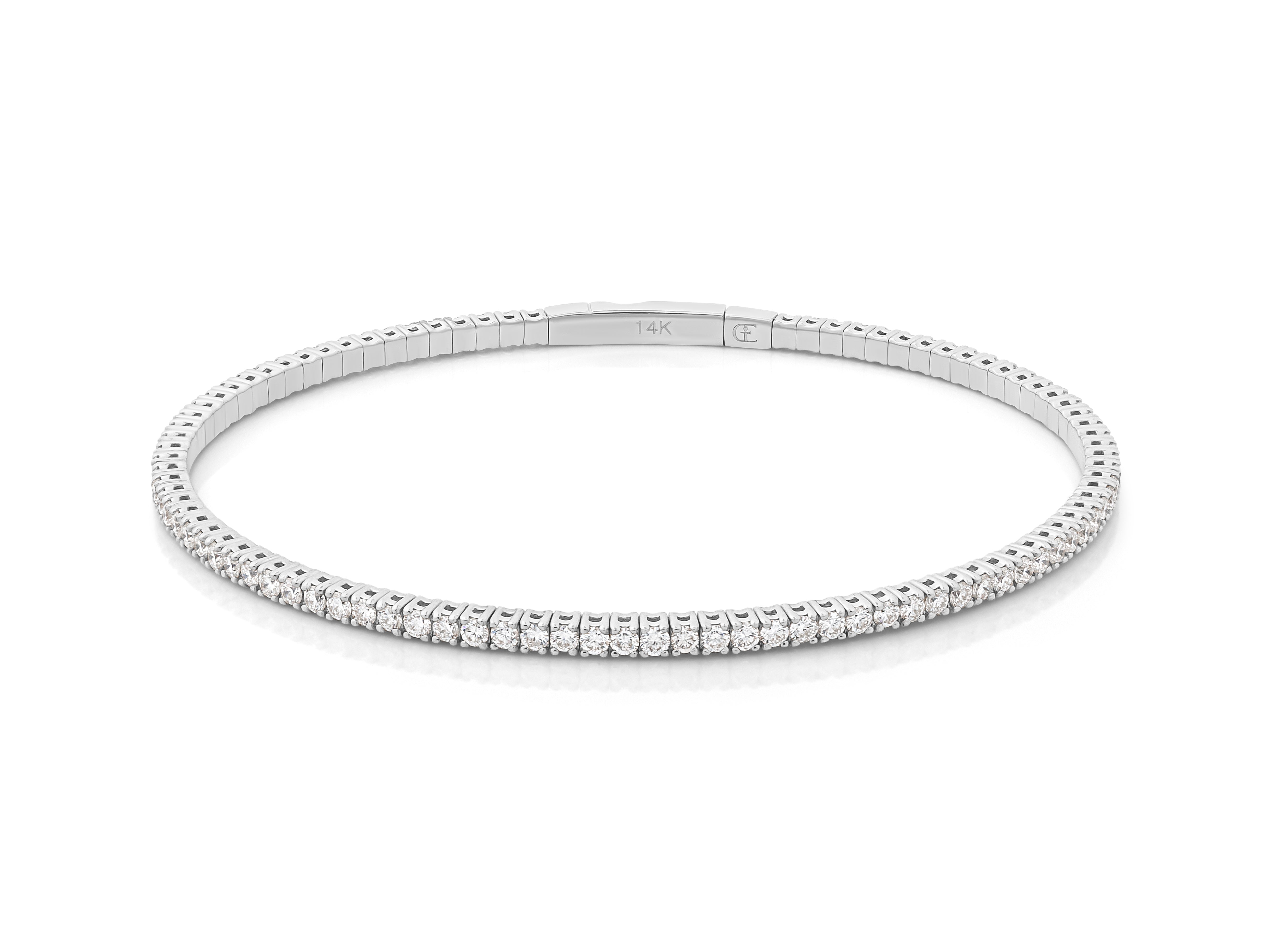 A gold diamond bangle bracelet with a lobster clasp closure.