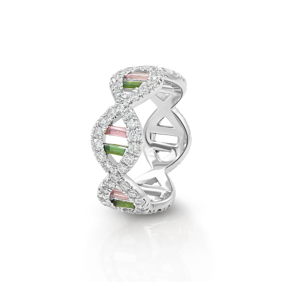 A 14K white gold ring featuring a DNA double helix design with diamond quality VS and green and pink tourmaline baguettes.