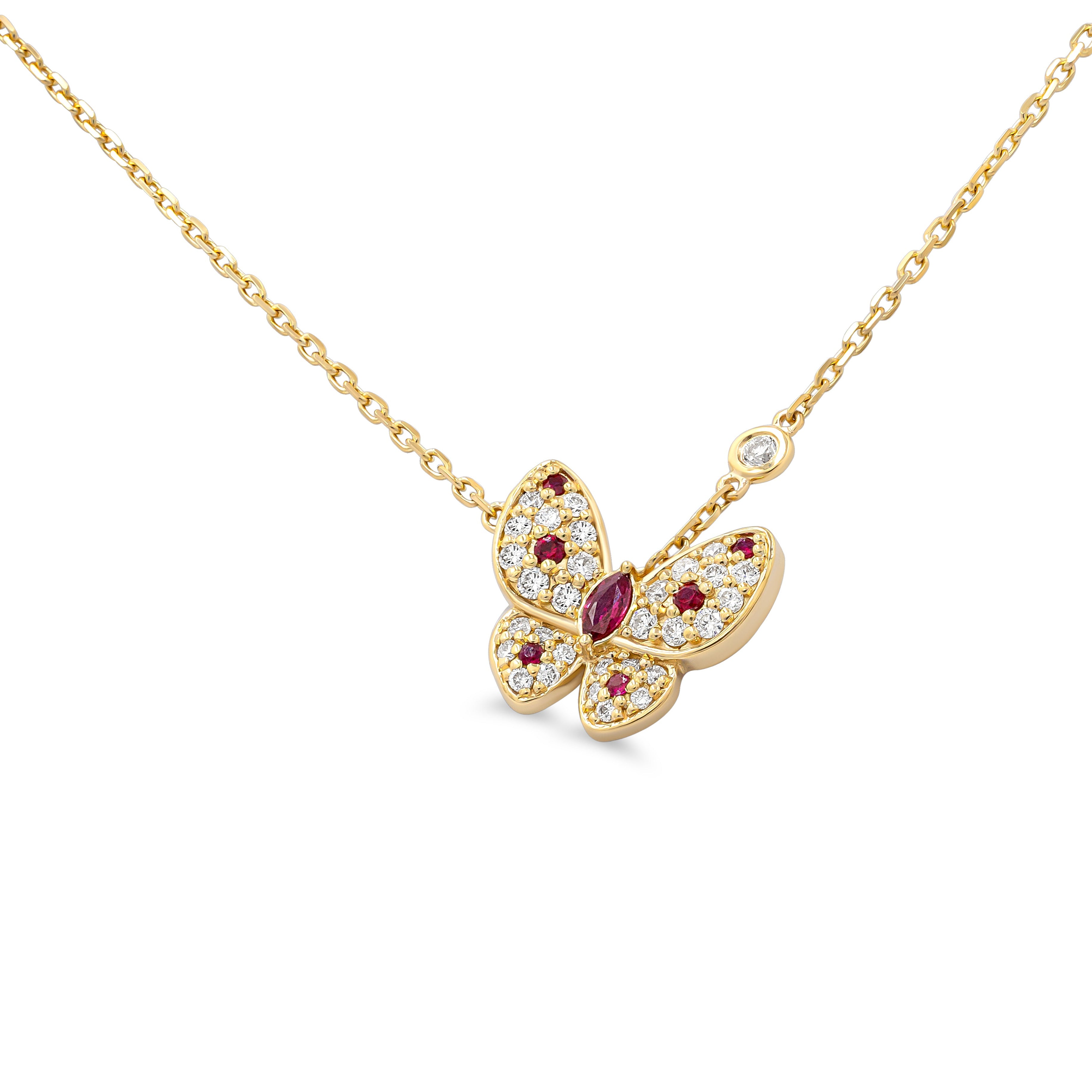 Gold butterfly necklace with red gemstones and diamonds