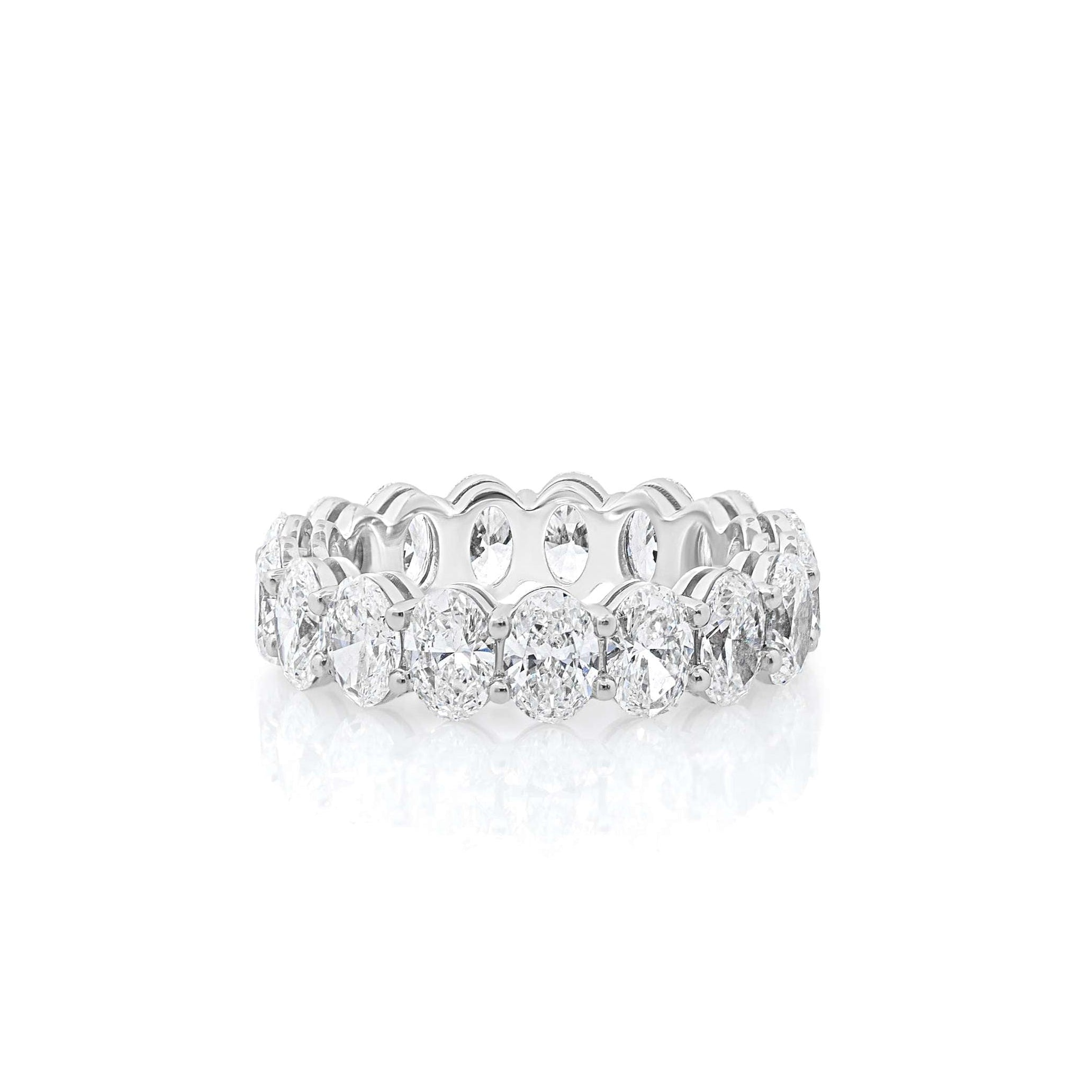 An oval cut diamond eternity band ring with white gold