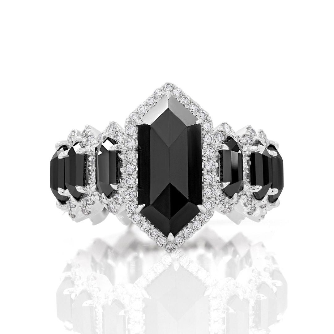 A black hexagon ring with white diamond accents set in white gold.