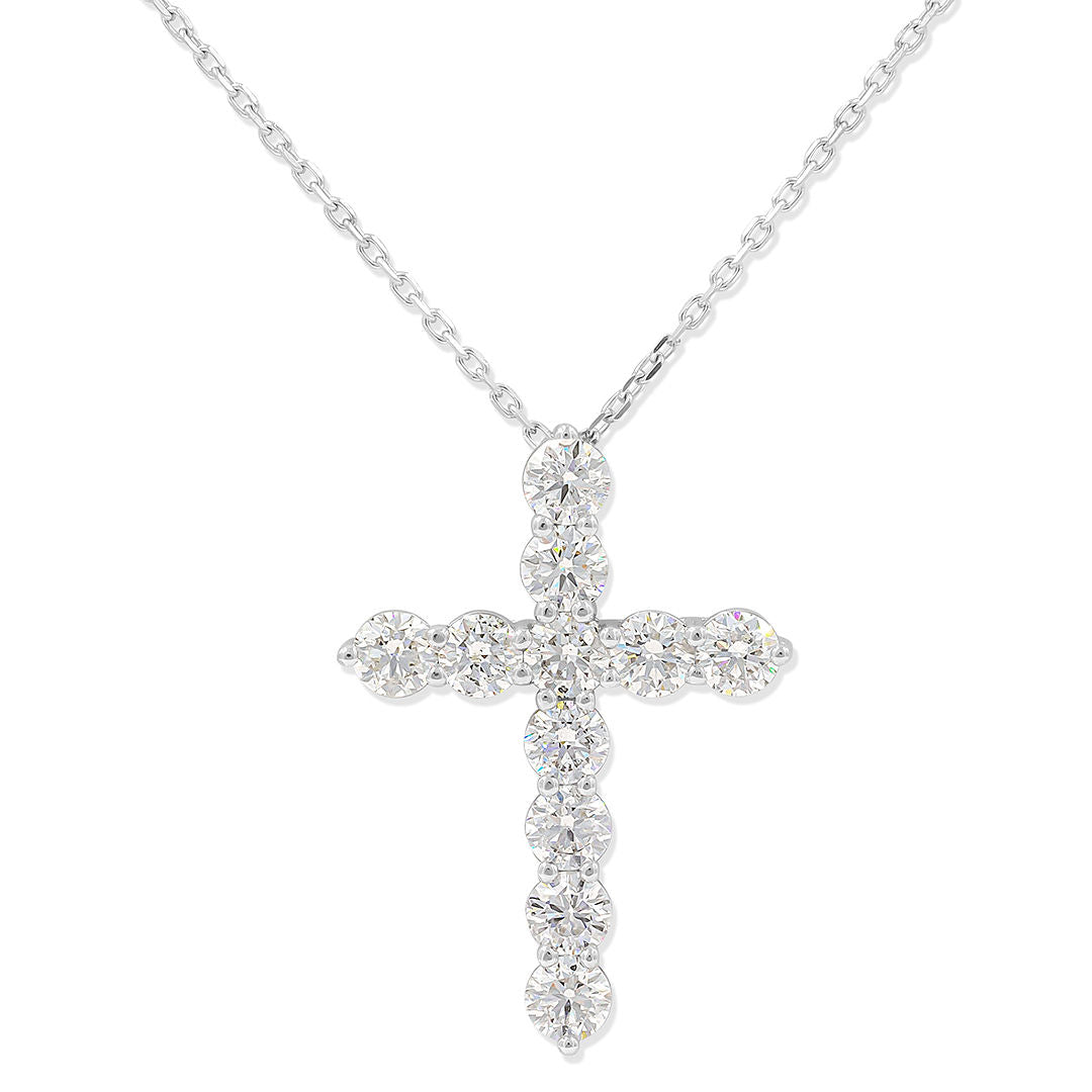 A 14kt white gold cross pendant with a 3ct total of diamonds, displayed with an 18 inch necklace.