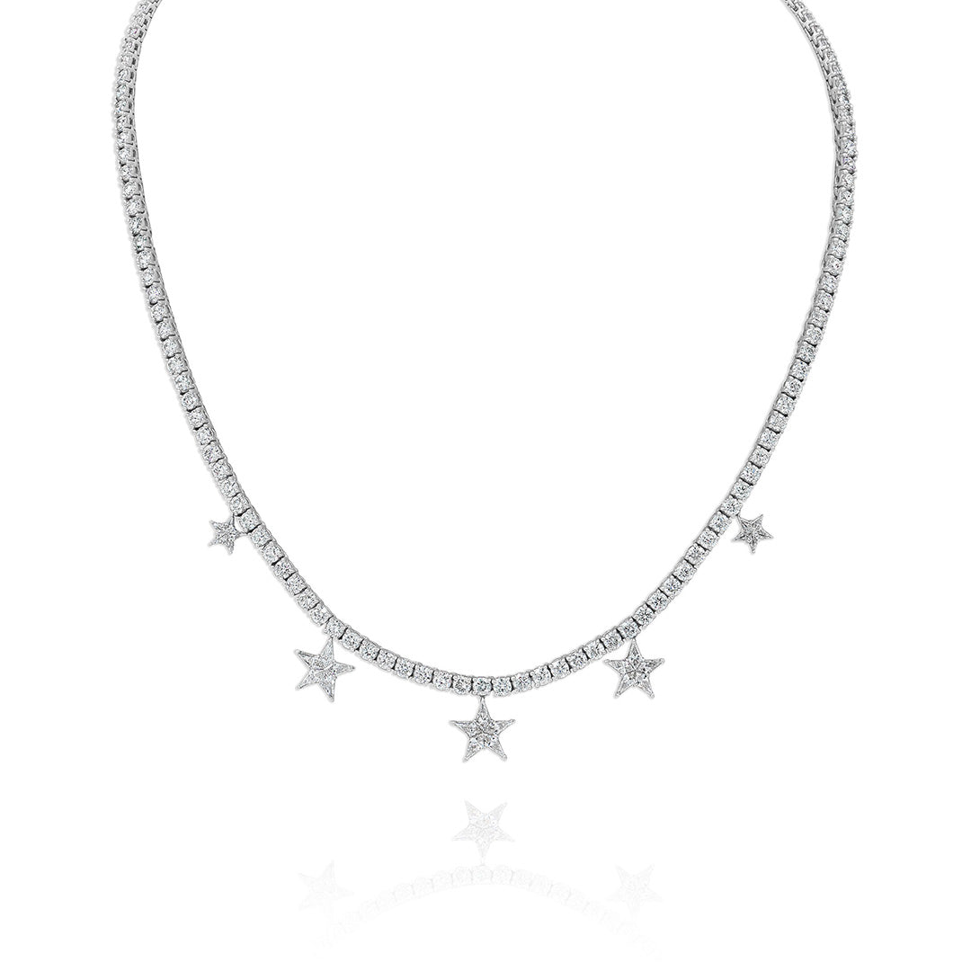 A white gold tennis chain necklace with diamond accents and star charms every few inches.