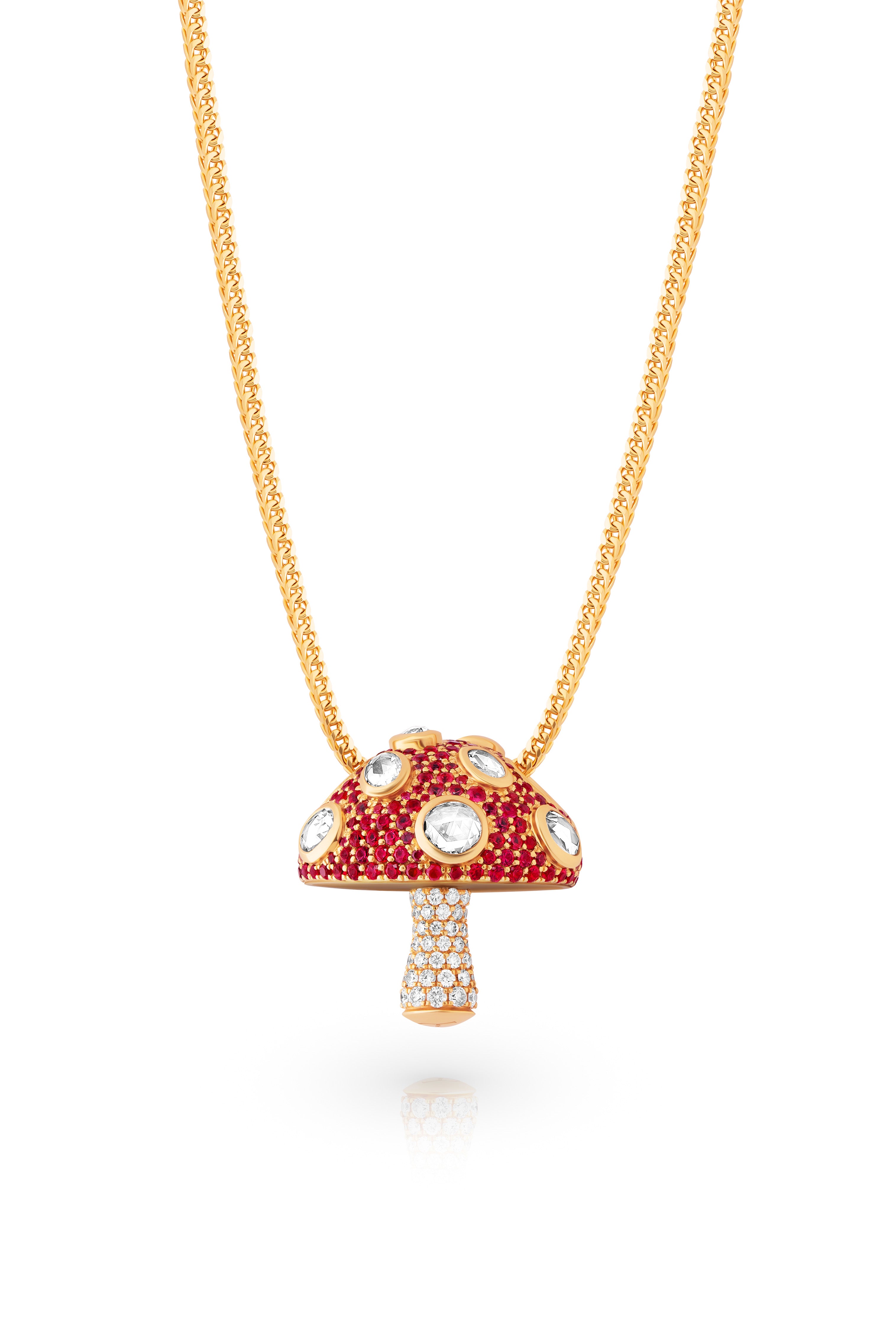 Gold necklace with a red and gold mushroom pendant on a white background.