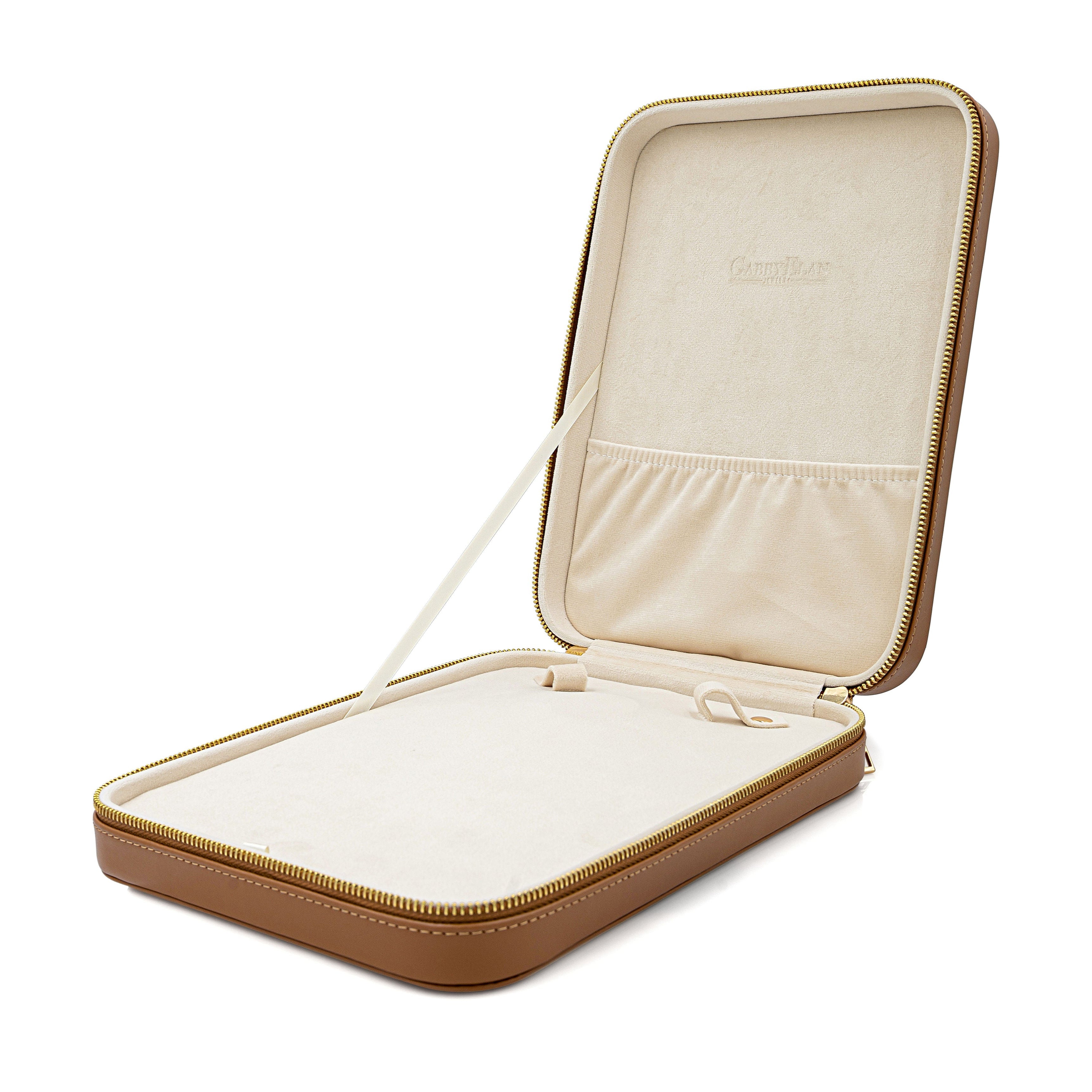 beige jewelry case with a white interior