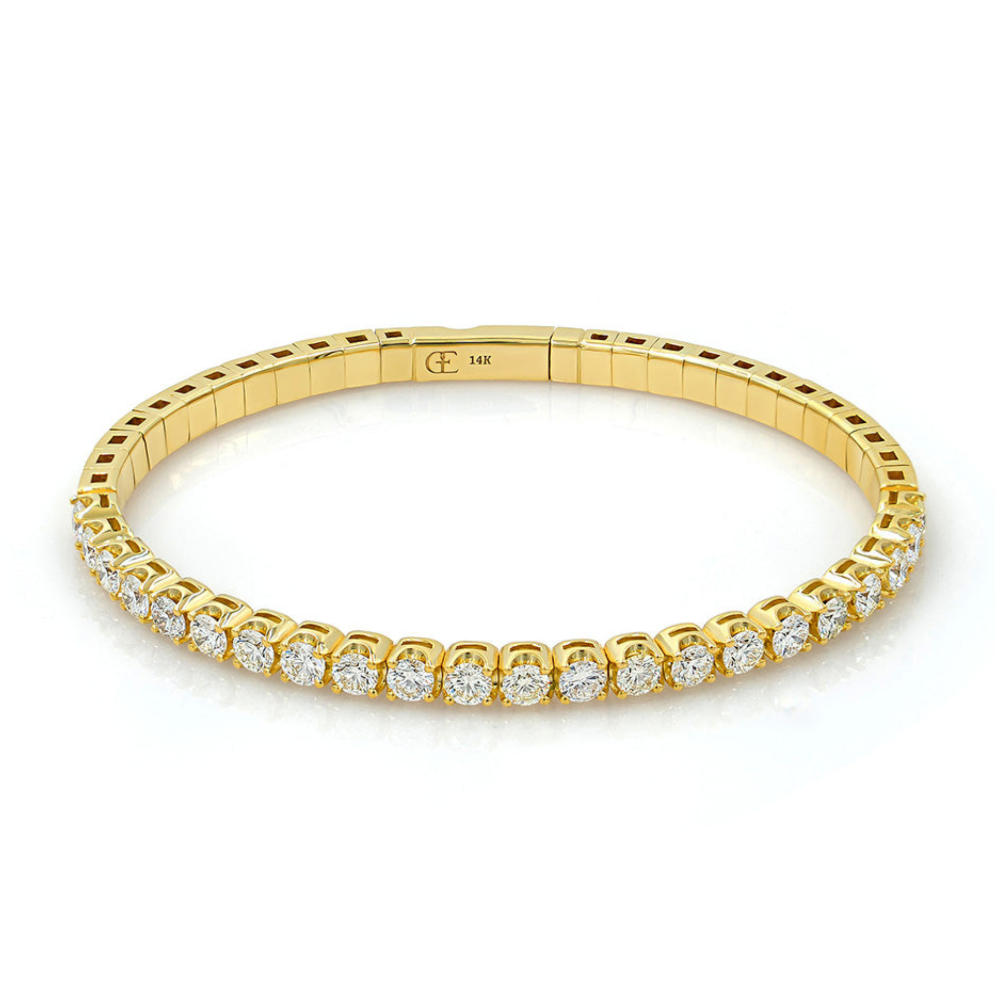 A gold bangle bracelet encrusted with diamonds.