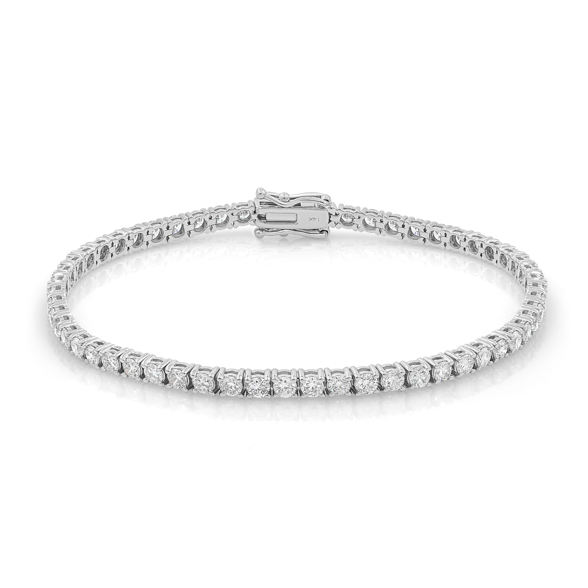 A white gold diamond tennis bracelet with a length of 7 inches and a width of 2.2mm, featuring a row of evenly spaced round diamonds set in a single file.