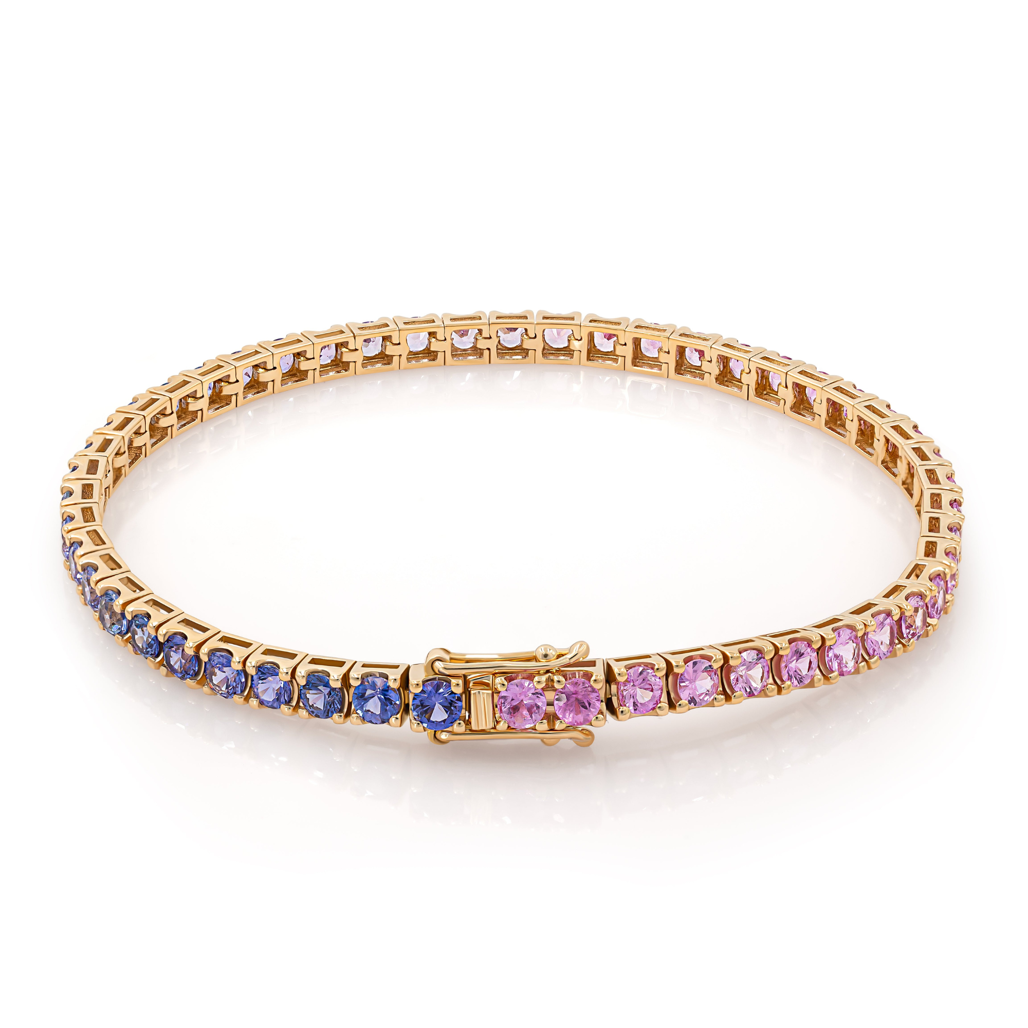 A pink and purple gradient rose gold tennis bracelet with a clasp closure.