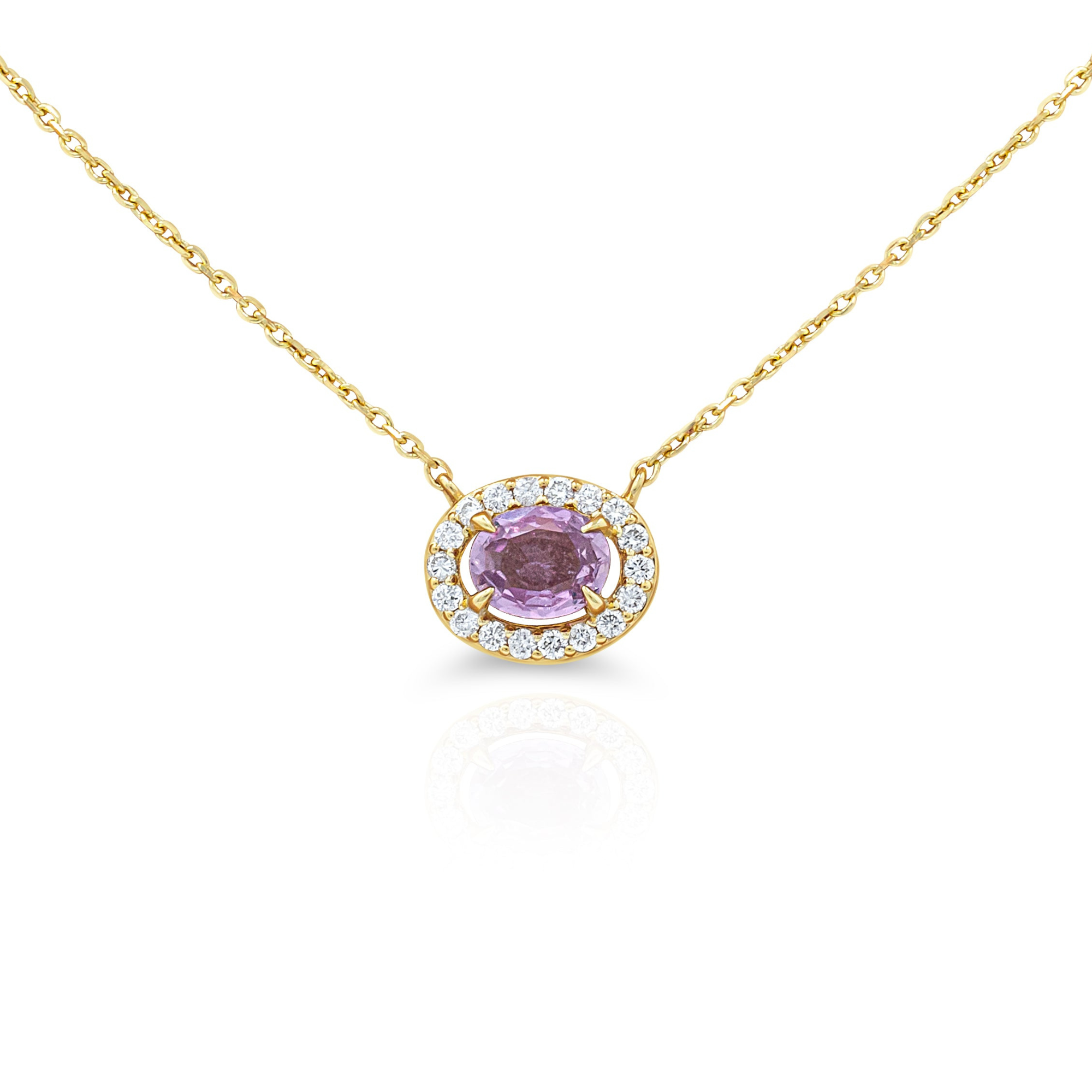 A pink sapphire pendant with a diamonds halo, attached to a gold chain.