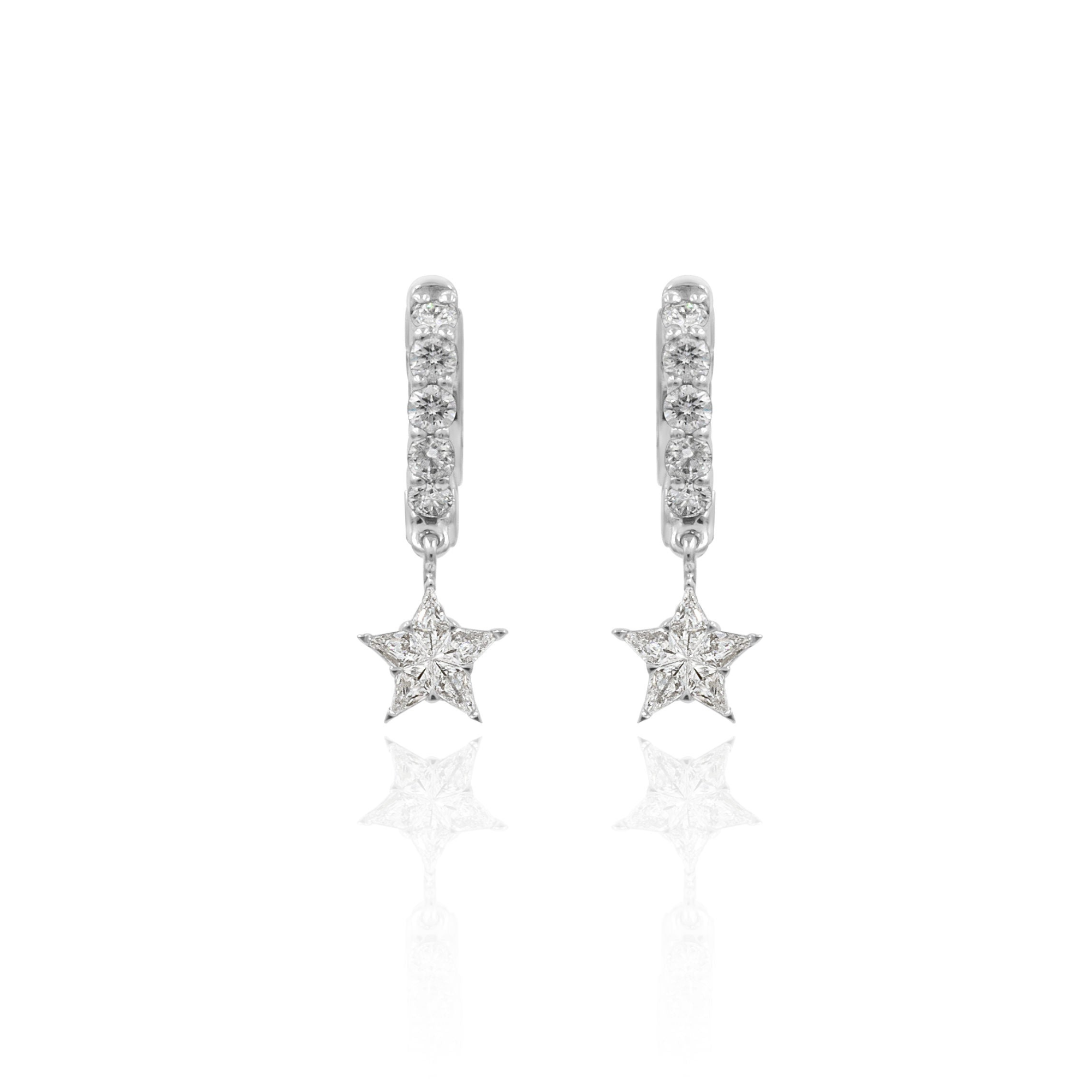 A pair of white gold dangling hoop earrings with star shapes, studded with diamonds.