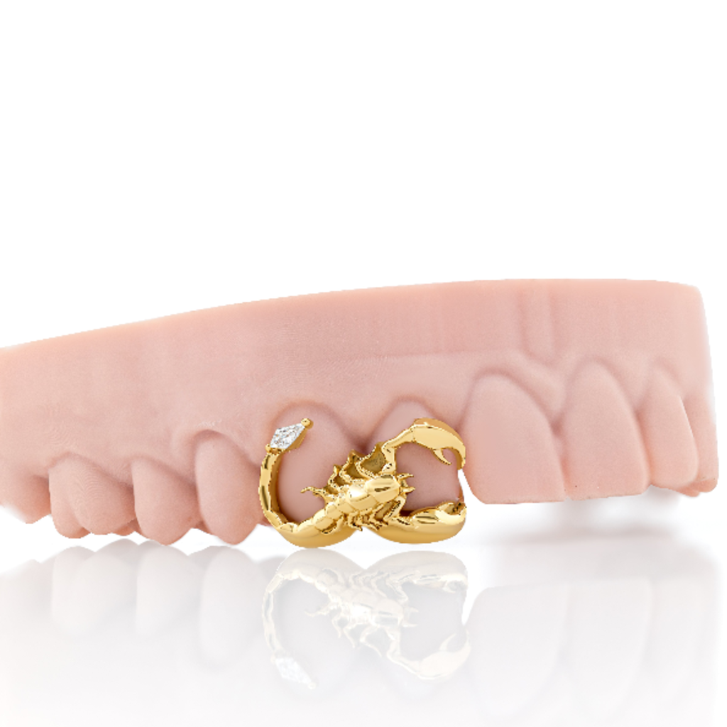 scorpion tooth grillz gold
