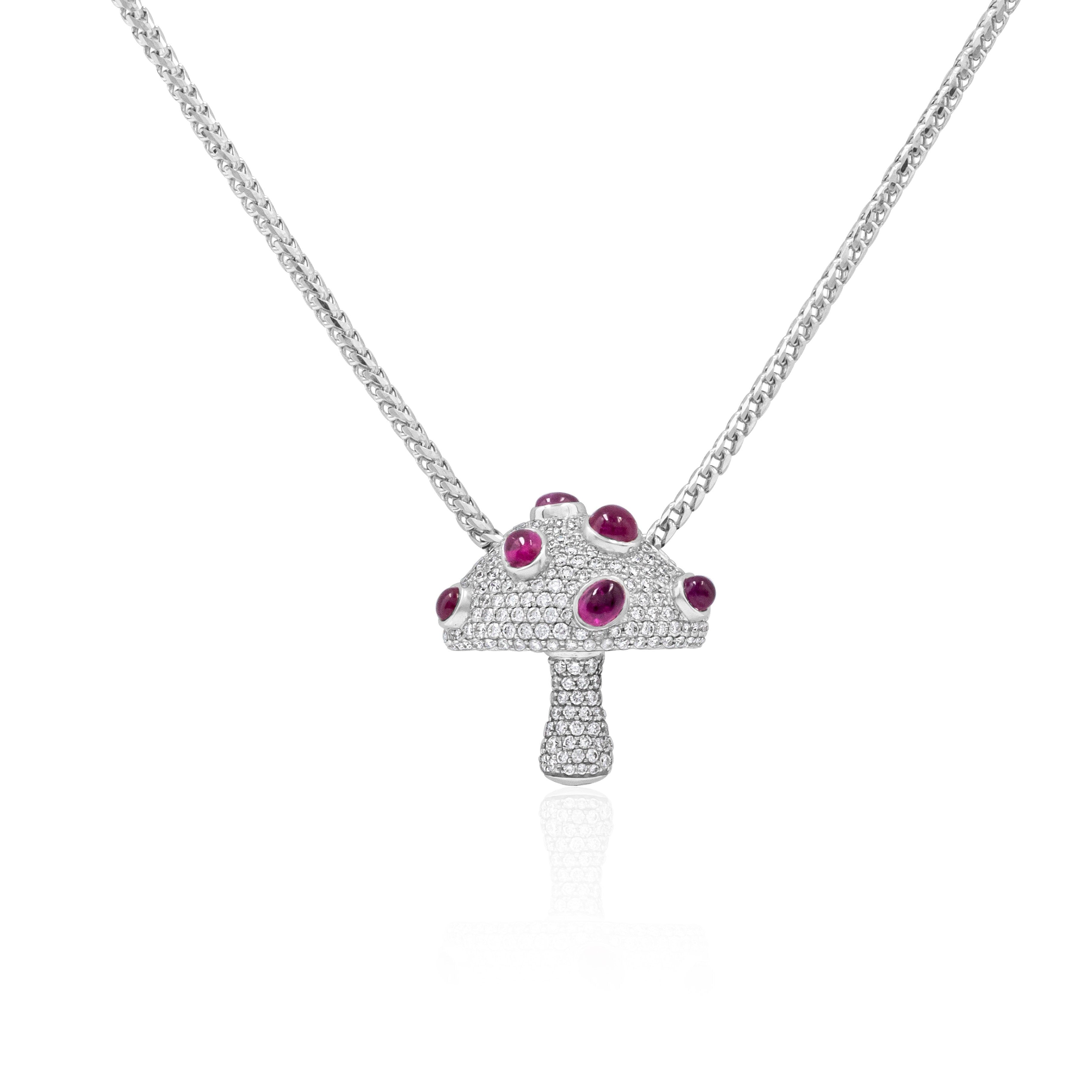 white gold mushroom-shaped pendant with red gemstones